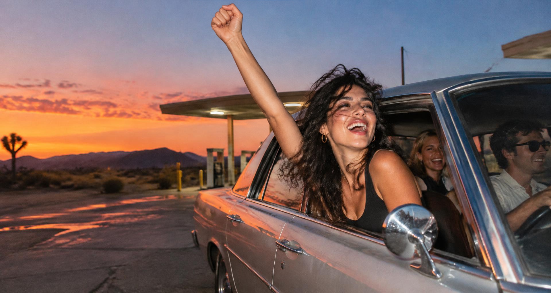 Adult friends taking an impromptu desert road trip at sunset